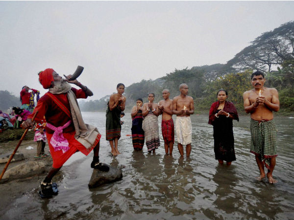A sadhu blows a buffalo horn A sadhu blows a buffalo horn
