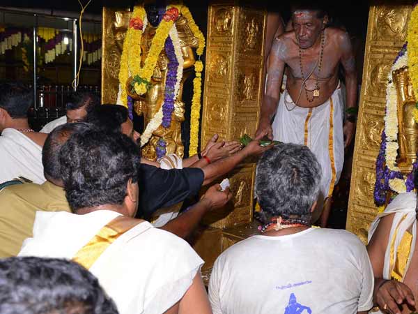 Temple priest performing pooja