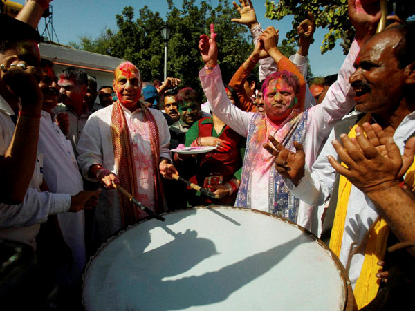 Rajnath Singh playing Nagara during the celebrates Holi Rajnath Singh playing Nagara during the celebrates Holi