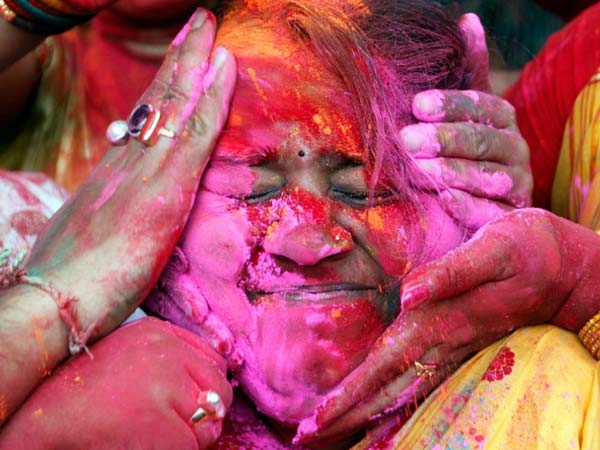 Woman celebrating Holi Woman celebrating Holi