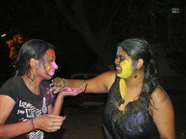 Woman celebrating Holi Woman celebrating Holi