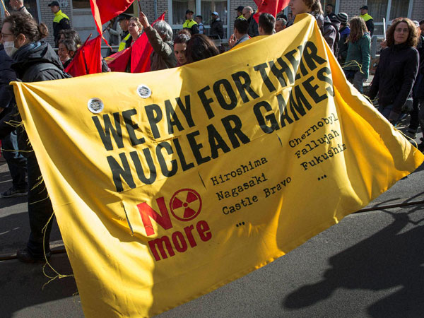 Protestors carry a banner during a demonstration