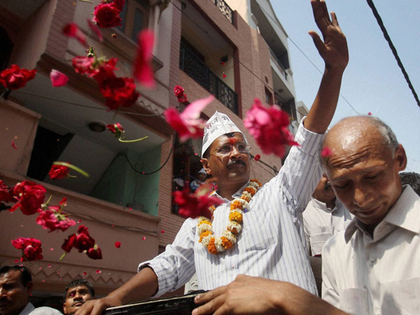Arvind Kejriwal waves during an election campaign