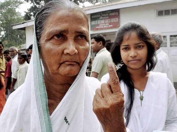 83 years old women shows the mark after casting vote