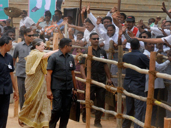Sonia Gandhi meeting people during an election rally in Kolar