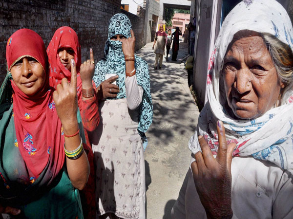 Women show their mark after casting their vote in Sonipat