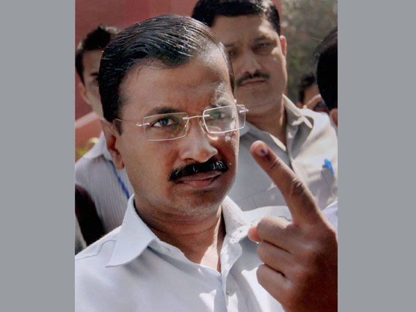 AAP convener Arvind Kejriwal shows the indelible ink on his finger