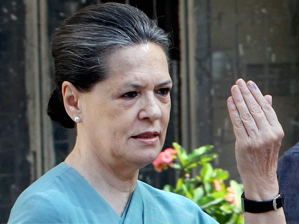 Sonia Gandhi shows her ink-marked finger