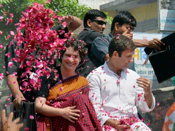 Supporters shower flower petals on Congress Vice President Rahul Gandhi