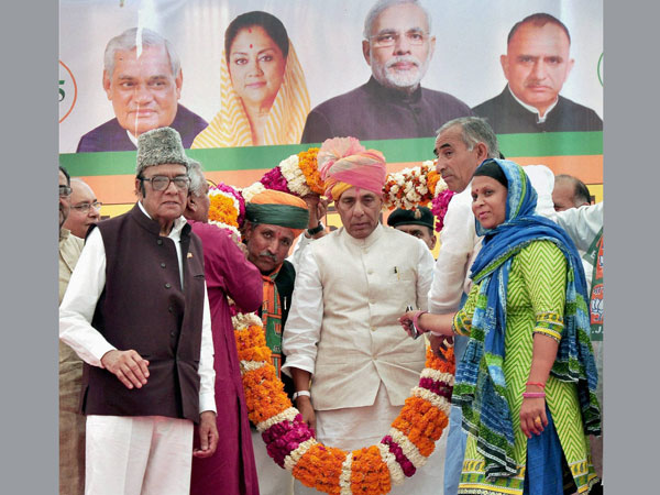 ajnath Singh being welcomed at an election rally