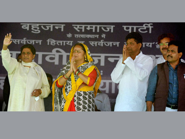 Mayawati waves during an election rally in Agra