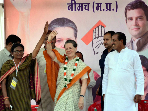 Sonia Gandhi waves at an election meeting in Neemuch