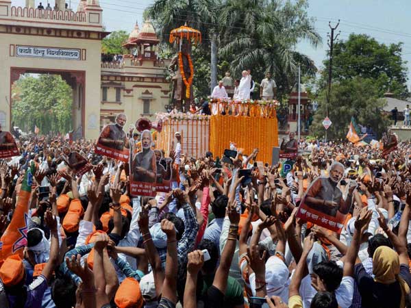 Narendra Modi waves at supporters