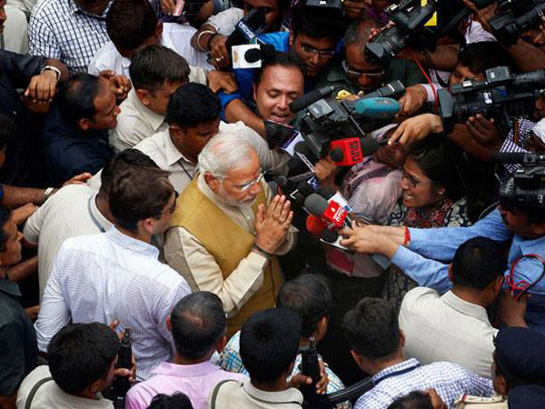 Surrounded by the media and the press
