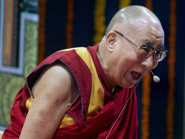 Tibetan spiritual leader the Dalai Lama interacts