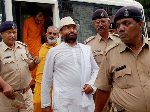 Narayan Sai is taken to a court in Surat
