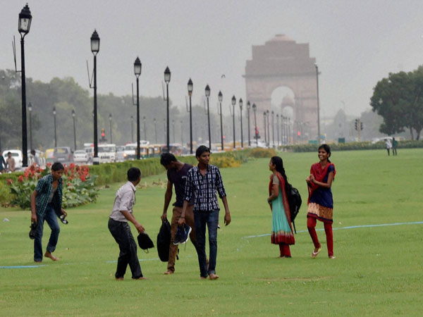 Youngsters enjoy the rains at an India Gate lawn Youngsters enjoy the rains at an India Gate lawn