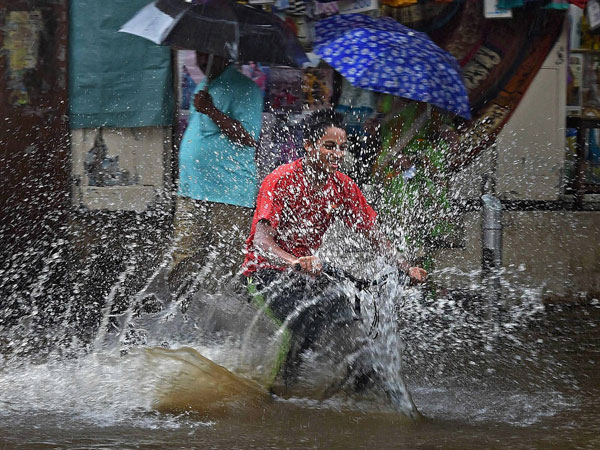Image result for a boy with a cycle in rain