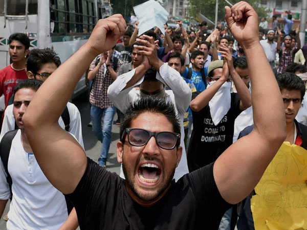 Students shout slogans during a protest