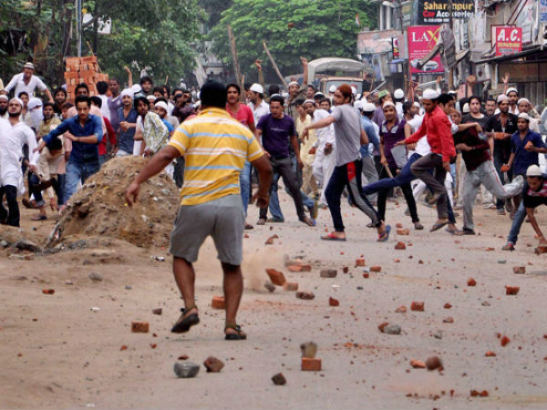 Stone pelters in action during the clashes. (PTI photo)