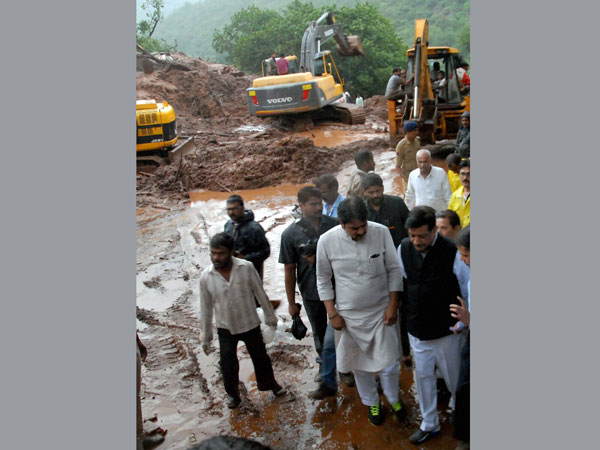 Maharashtra Chief Minister Prithviraj Chavan visits the site of a landslide
