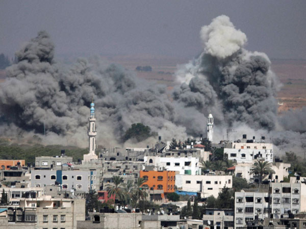 Smoke rises after an Israeli strike in Gaza City Smoke rises after an Israeli strike in Gaza City