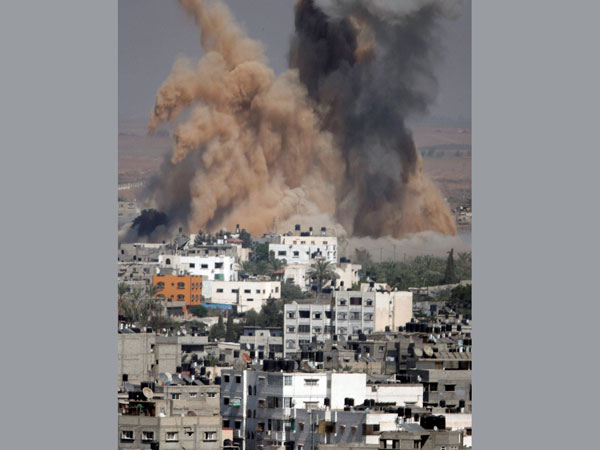 Smoke and sand from an explosion rise after an Israeli strike Smoke and sand from an explosion rise after an Israeli strike