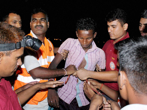 Army soldiers and SDRF staff rescue a boy trapped
