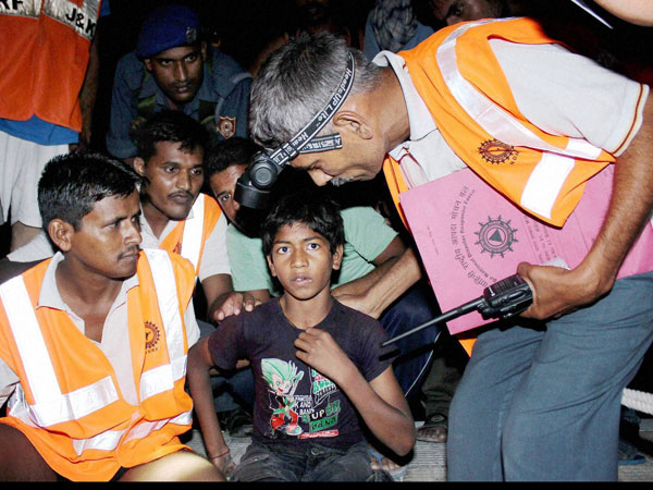 Army soldiers and SDRF staff rescue a boy trapped