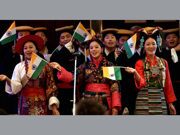 Tibetan artists perform a song