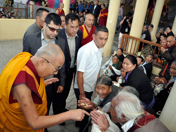 Tibetan spiritual leader the Dalai Lama is greeted