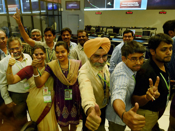 ISRO scientists and other officials celebrate the success