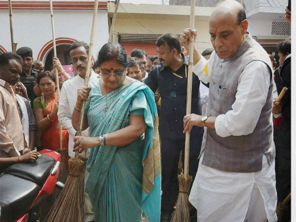 Rajnath Singh sweeps along with his wife Savitri