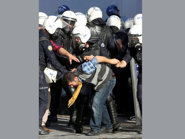 Turkish riot police detain protestor