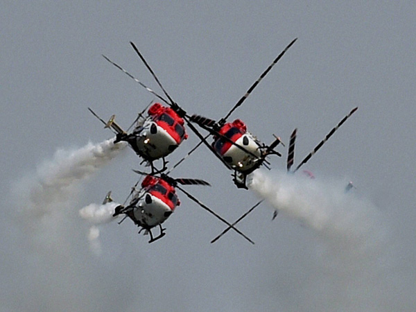 Sarang helicopters fly in a formation
