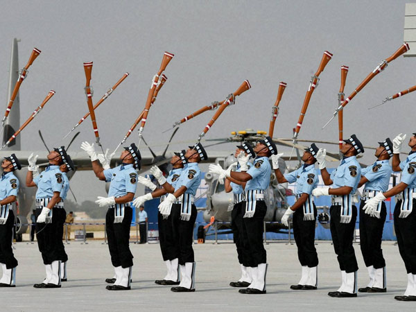 IAF personnel perform with their guns