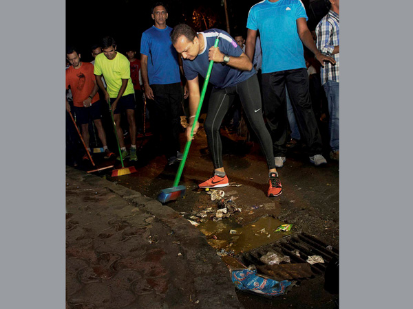 Industrialist Anil Ambani participates in a clean drive
