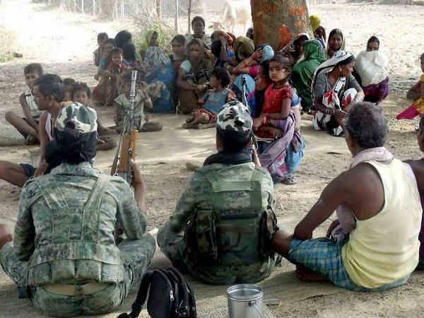 Naxals open fire on poll center