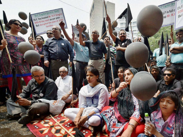  Flat owners under the banner of Capital Green Flat Buyers Association protesting against DLF due to delayed delivery of flats at DLF's Corporate Office in New Delhi on Saturday.