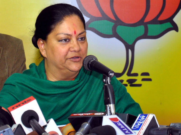 Raje distributes portfolios to ministers