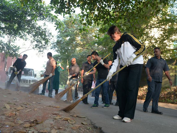 Big B seen wielding the broom