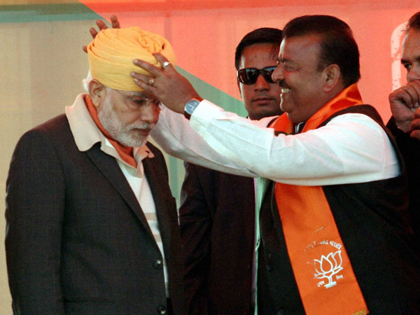 Narendra Modi is presented a turban