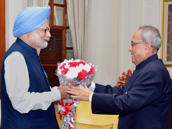 Manmohan Singh greets President Pranab Mukherjee