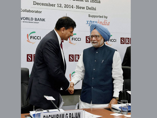 Former Prime Minister Manmohan Singh greets the RBI Governor