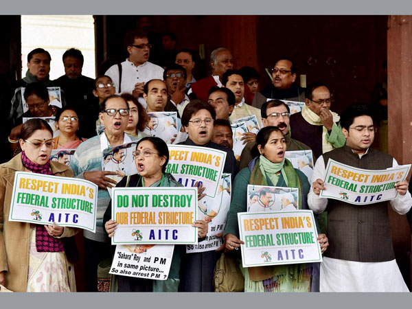 Members of TMC protest outside the Parliament