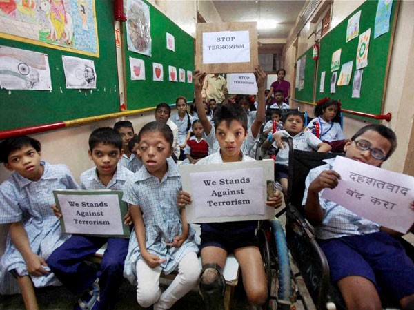 Physically challenged students hold placards
