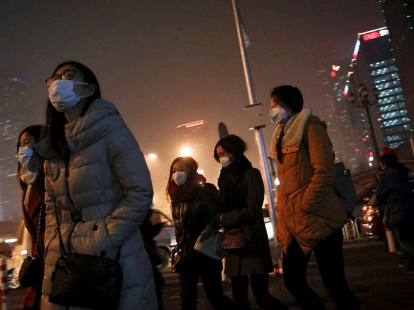 Women wearing masks to protect themselves from pollutants walk to a subway station on a polluted day in Beijing, Tuesday, Dec. 8, 2015. Beijing's red alerts for smog are as much about duration as they are about severity of pollution forecasts. The forecasting model must predict three or more days of smog with levels of 300 or higher on the city's air quality index - which typically would include having levels of dangerous PM 2.5 particles of about 10 times the safe level. Women wearing masks to protect themselves from pollutants walk to a subway station on a polluted day in Beijing, Tuesday, Dec. 8, 2015. Beijing's red alerts for smog are as much about duration as they are about severity of pollution forecasts. The forecasting model must predict three or more days of smog with levels of 300 or higher on the city's air quality index - which typically would include having levels of dangerous PM 2.5 particles of about 10 times the safe level.