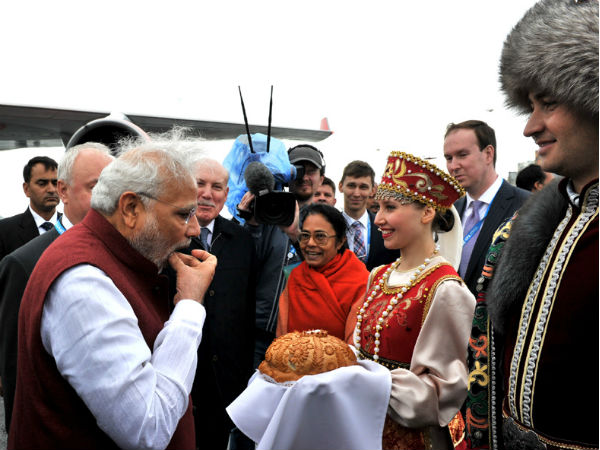 PM Modi being greeted at airport in Russia PM Modi being greeted at airport in Russia
