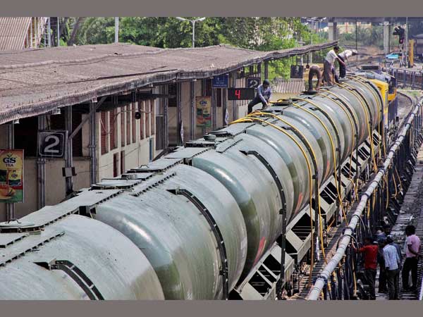 Workers fill water in Central Railway train tanks to transport to drought affected Latur District from Miraj station near Sangli Workers fill water in Central Railway train tanks to transport to drought affected Latur District from Miraj station near Sangli