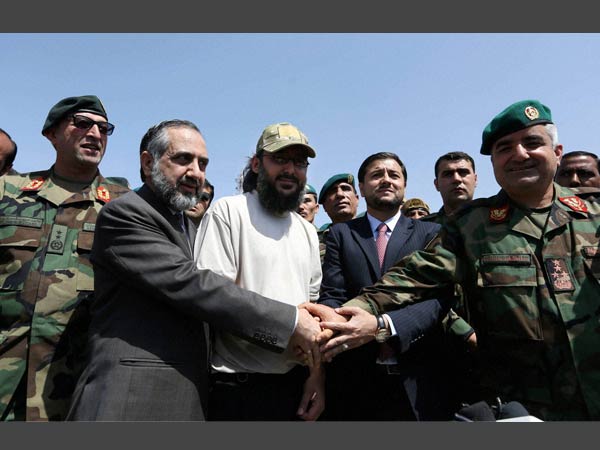Ali Haidar Gilani son of a former Pakistani prime minister, center shakes hand with Pakistani Ambassador Abrar Hussain and Afghan Army Officials, as he arrives at the Afghan Ministry of Defense in Kabul. Ali Haidar Gilani son of a former Pakistani prime minister, center shakes hand with Pakistani Ambassador Abrar Hussain and Afghan Army Officials, as he arrives at the Afghan Ministry of Defense in Kabul.